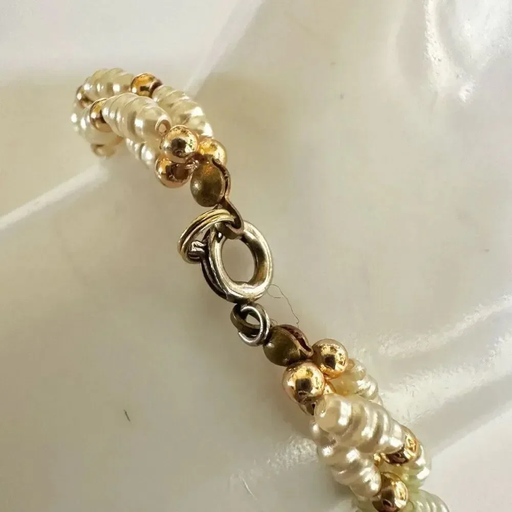 Faux pearl twisted multi strand bracelet